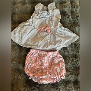Matching top and short, blue and white striped, with a pink bow size 18M